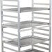 A silver Regency sheet pan rack with trays on it.