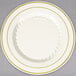 A Fineline Silver Splendor plastic plate in bone/ivory with gold bands on the rim.