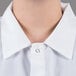 A person wearing a white Chef Revival cook shirt.