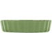 A green rectangular dish with scalloped edges.