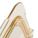 A clear plastic Carlisle StorPlus lid with a gold handle.