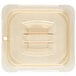 A Carlisle amber plastic lid with a handle on a plastic container.