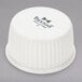 A case of 48 white Tuxton fluted china ramekins with a white lid.