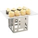 A tray of cupcakes on a Cal-Mil stainless steel cube riser.