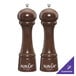 Two brown Chef Specialties Windsor walnut pepper mills with white text that says "Savor" on a table.