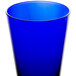 A blue glass tumbler on a white background.