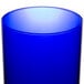 A close up of a Libbey cobalt blue cooler glass.