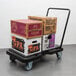 A Lavex platform truck with boxes on it.