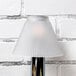 A Sterno table lamp with a white pleated shade.