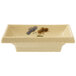 A white rectangular GET Tokyo melamine sauce dish with a flower design.