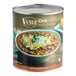 A Vanee Chili with Beans #10 can on a table in a grocery store aisle.