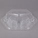 A clear plastic Genpak container lid with three compartments.