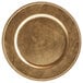 A Tabletop Classics by Walco gold plastic charger plate with beaded trim.