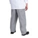 A person wearing Chef Revival houndstooth chef pants and a white shirt.