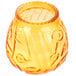 A yellow glass Sterno Venetian candle holder with a pattern on it.