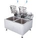 A Globe dual tank electric countertop fryer with two stainless steel containers.