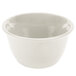 A white melamine bouillon cup with a handle on a white surface.