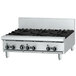 A stainless steel Garland countertop gas range with four burners and a griddle.