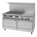 A commercial stainless steel gas range with six burners, a 24-inch griddle, and two standard ovens.
