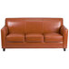 A brown leather Flash Furniture Hercules Diplomat sofa with wooden legs.