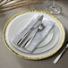 a plate with a napkin and silverware on it