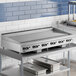 A Garland stainless steel countertop griddle with thermostatic controls.