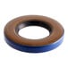 A close-up of a round blue and brown Hobart oil seal.
