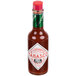 A TABASCO bottle of Sweet & Spicy Hot Sauce with a green label.