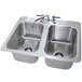 A stainless steel Advance Tabco drop-in sink with two bowls.