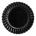 A black Fineline Flairware plastic plate with wavy edges.