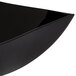 A black Fineline plastic serving bowl with a curved edge.