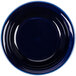 A blue fluted ramekin with a white background.