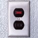 A close-up of a Kolpak walk-in freezer switch with red and black numbers.