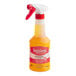 A close-up of a Vegalene spray bottle with a white and red label.