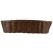 A close-up of a brown Tablecraft rattan basket with handles.