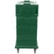 A green plastic Cambro Ultra Camcart food pan carrier with wheels.