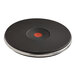 A black and silver circular plate with a red circle in the center.