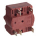 A red rotary power saver switch with multiple metal prongs for electrical connections.
