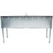 An Eagle Group underbar sink with two drainboards and a faucet on a metal table.