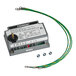 A grey Fenner control unit with a white label and wires connected.