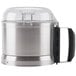 A silver and black stainless steel Robot Coupe cutter bowl with a lid.