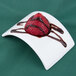 A strawberry with chocolate drizzle on a rectangular white porcelain bowl.