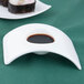 An Arcoroc rectangular white porcelain bowl with a sauce in it.