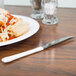 a plate of pasta with sauce and cheese