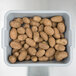 A gray Vollrath high density polyethylene bus tub filled with potatoes on a table.