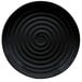 A black melamine plate with a spiral pattern in the center.