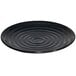 A black GET Milano melamine plate with ripples on it.