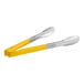 A pair of Vollrath tongs with yellow and silver handles.