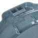 A close-up of a grey Rubbermaid Brute trash can lid with two holes.