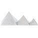 Three Ateco stainless steel pyramid molds on a table.